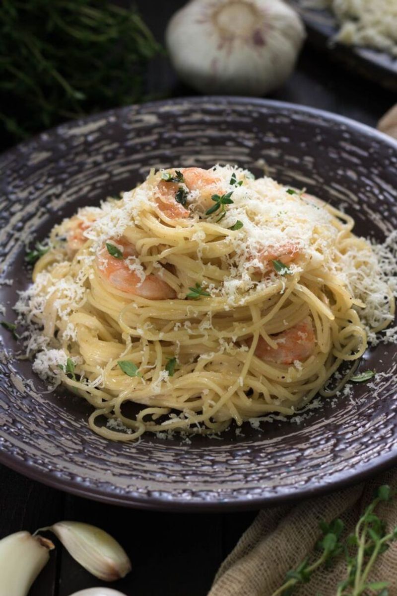 Drenching Seafood Pasta With Parmesan