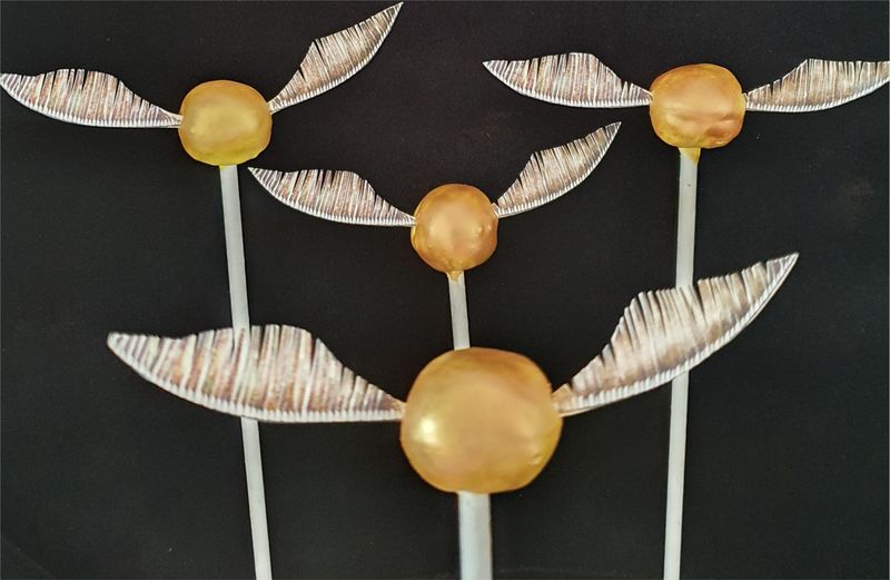 Golden Snitch Cake Pops That Fly Off The Plate