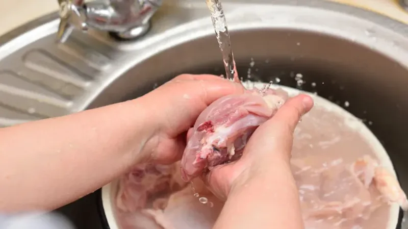 Washing Raw Chicken In The Sink