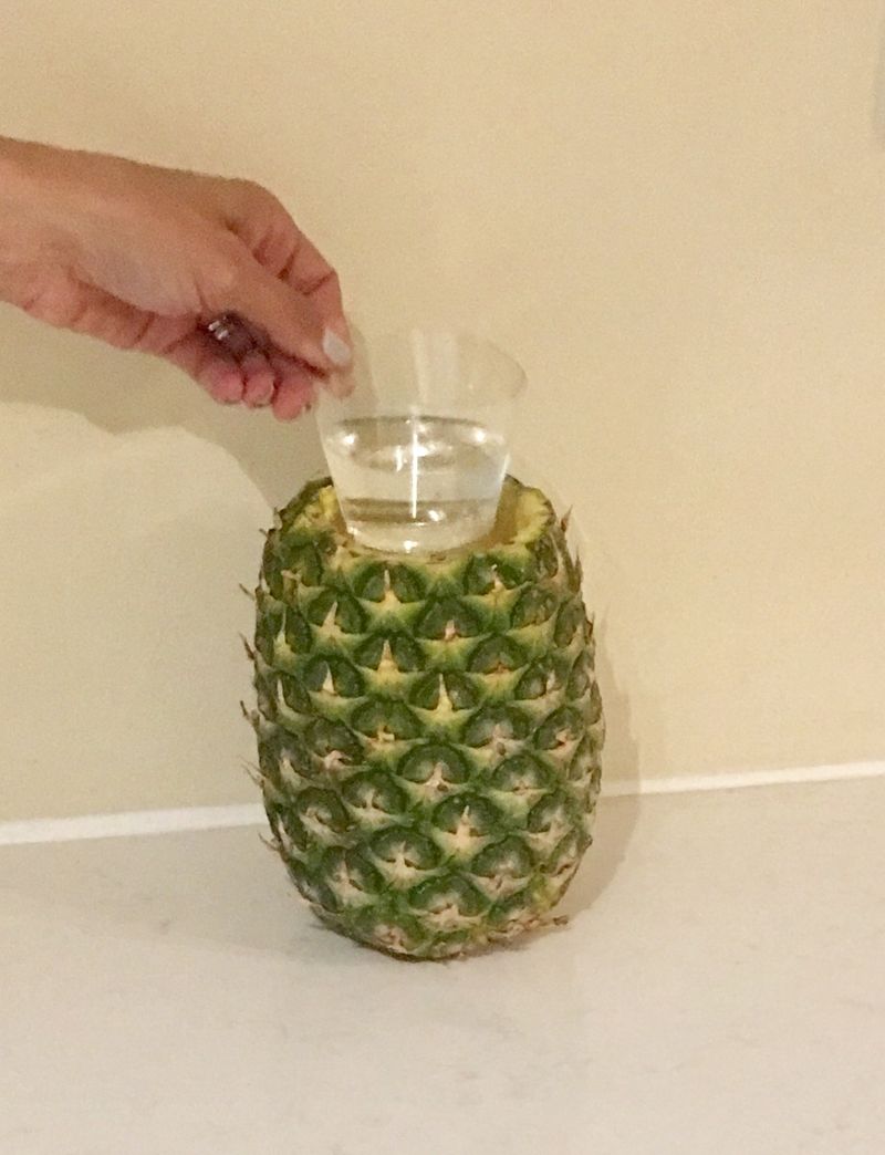 Use A Glass To Scoop Pineapple Chunks