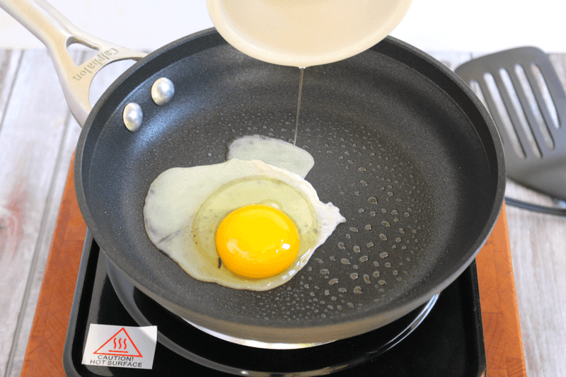 Add The Egg Gently Into The Center Of The Pan