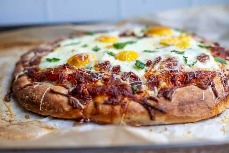 Breakfast Pizza With Bacon And Runny Eggs