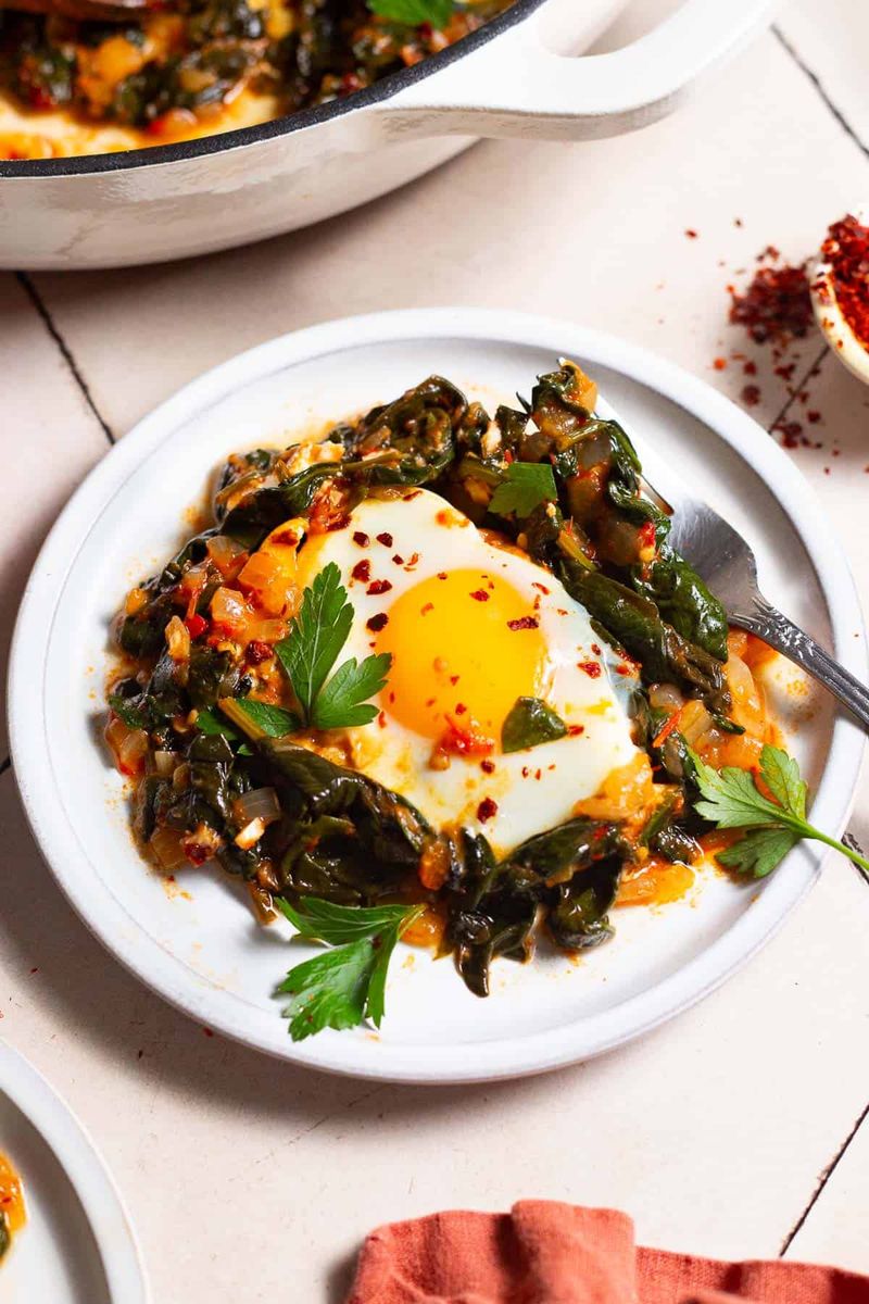 Fried Egg Over Sautéed Spinach And Garlic