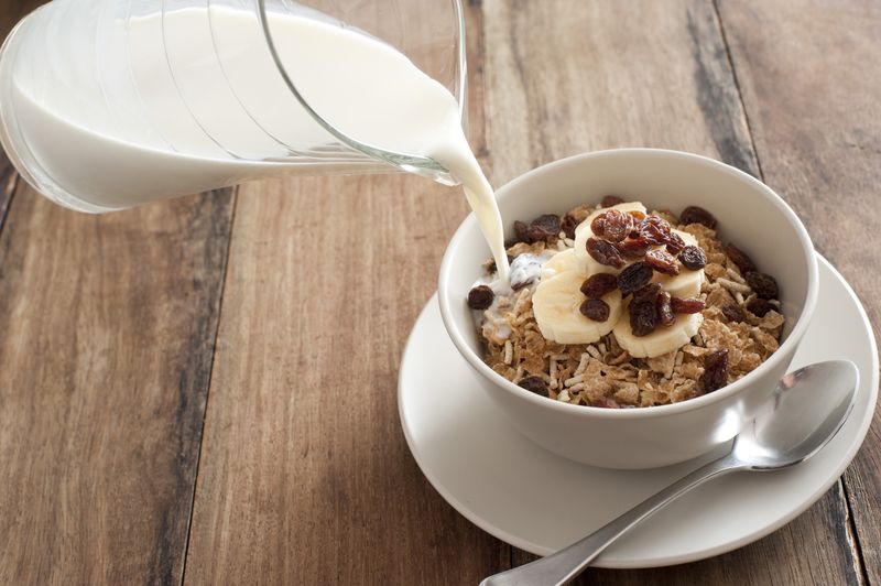 A Cup Of Cereal With Milk