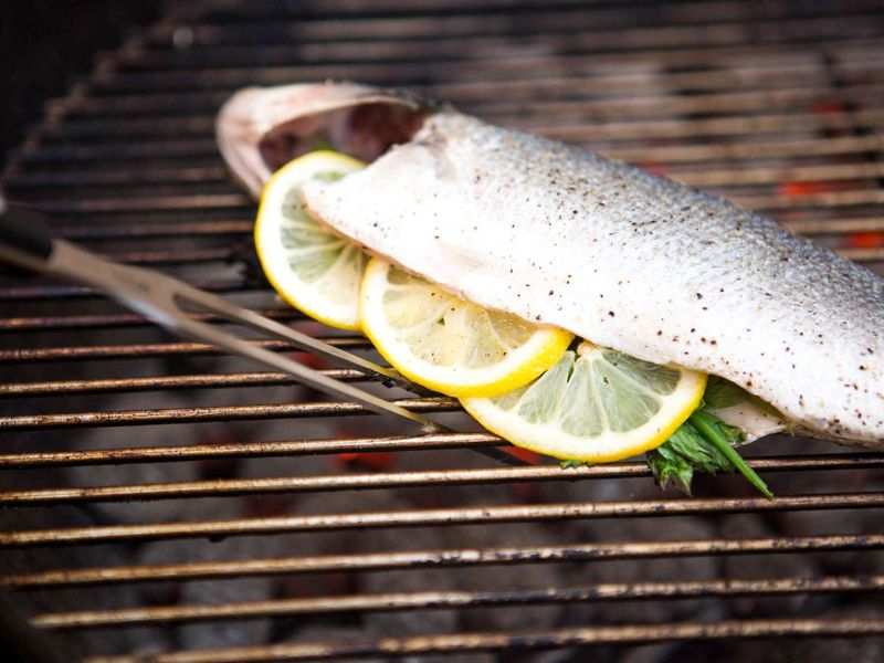Fish Grilling On Citrus Slices