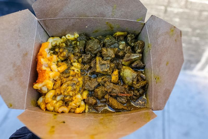 Curry Goat With Mac & Cheese